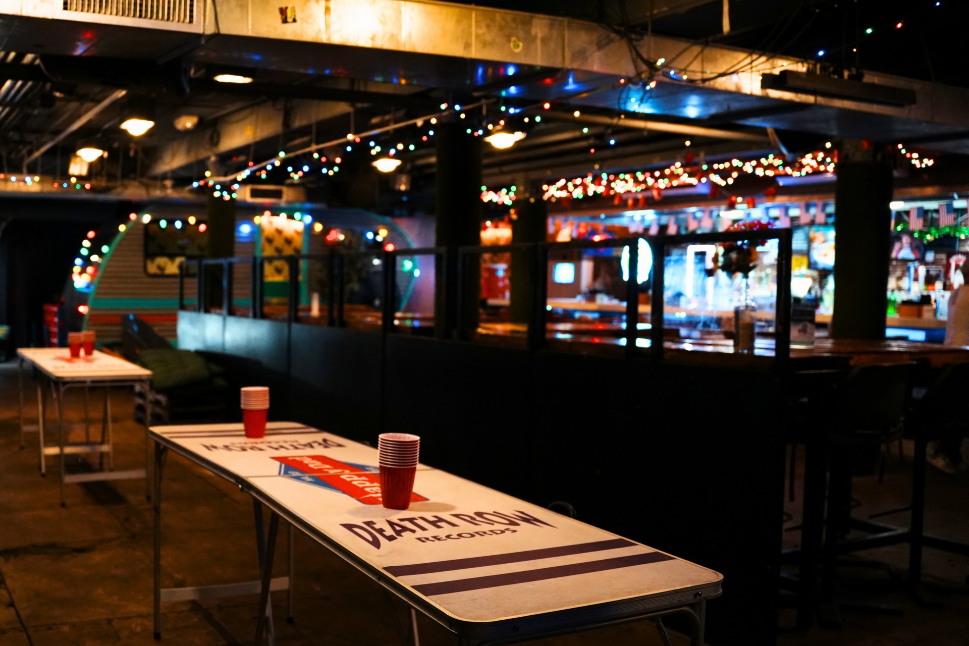 Beer pong table set up with red cups inside Trailer Park After Dark, a holiday party venue in downtown San Diego