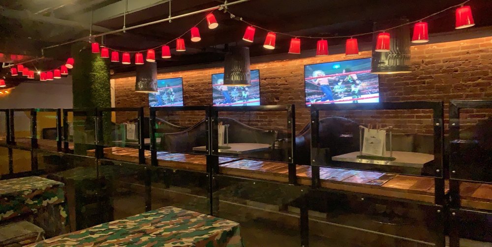 Booth seating with string lights at this comfort food bar San Diego keeps filling