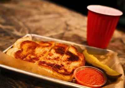 Grilled cheese with tomato soup and a pickle at Trailer Park After Dark