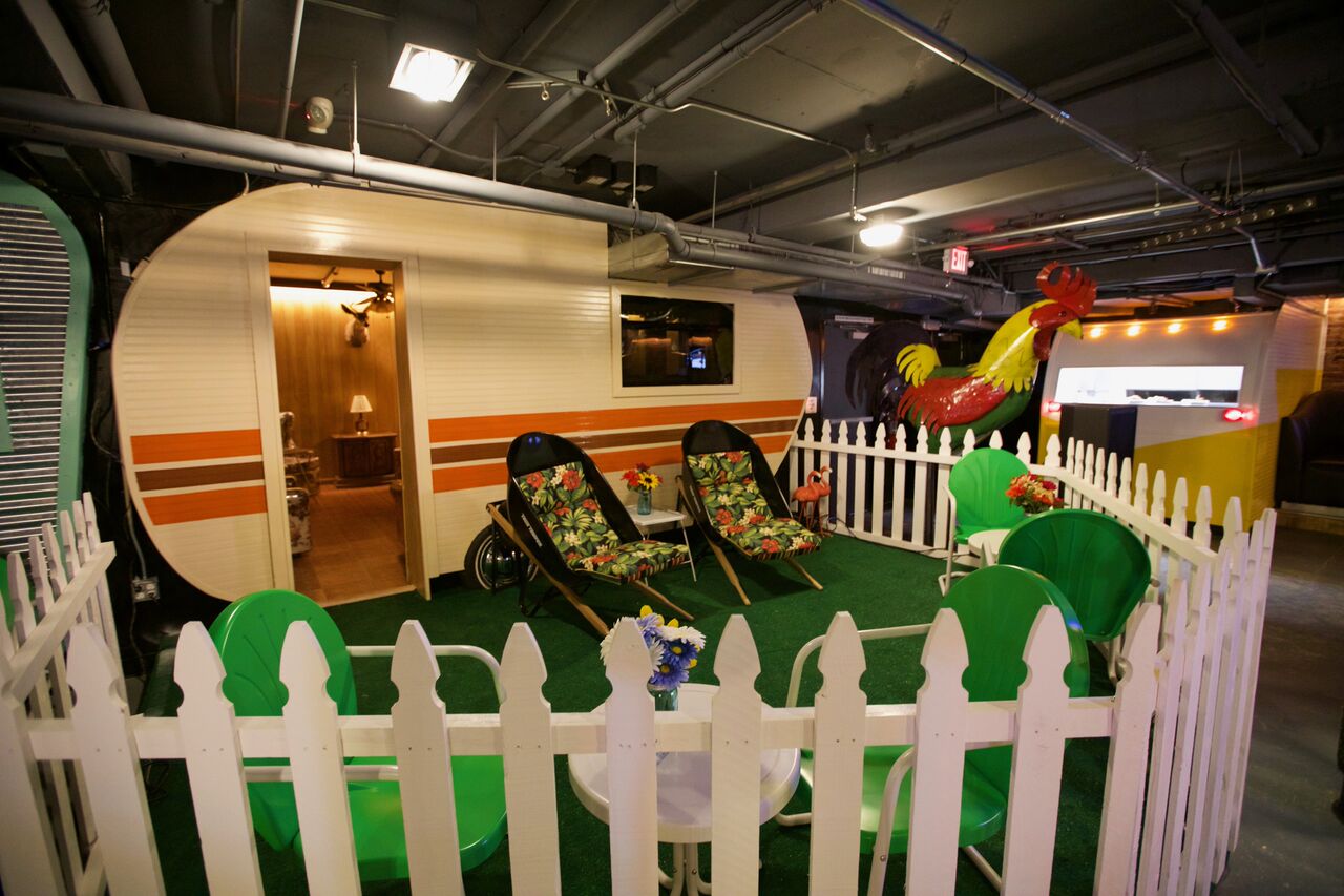 Large trailer and yard setup inside Gaslamp Quarter nightlife venue Trailer Park After Dark